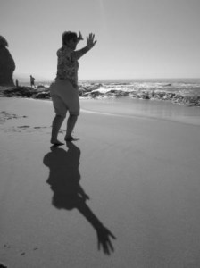 Linda on the beach, practicing tai chi